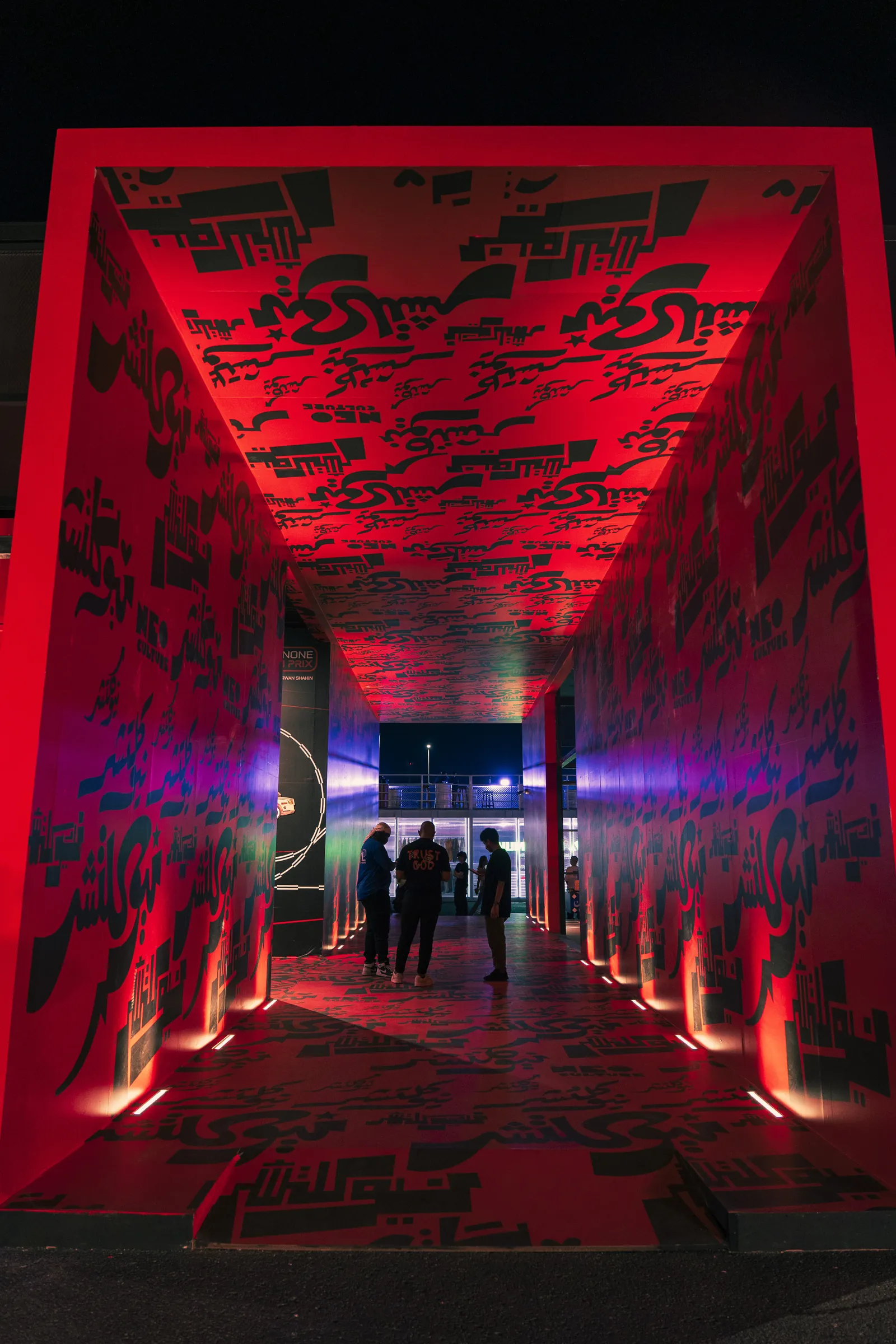 A bold ism x festival corridor that pulls visitors off the street and walks them through the space